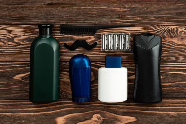 Barber shop tools on old wooden background